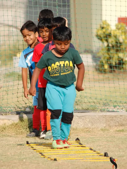 Concentrating on every step, this player masters the agility ladder, a core part of our summer camp training program.
