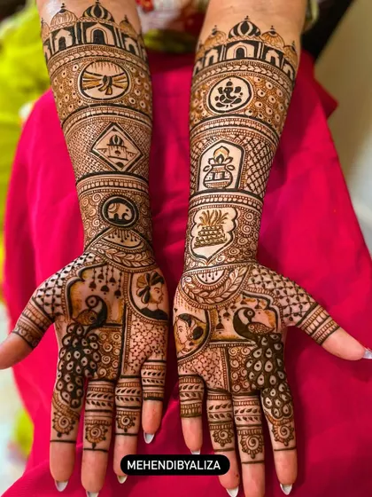 This design is pure magic, featuring peacocks and portraits that tell a story. The intricate patterns on the arms complement the central figures on the palms perfectly.