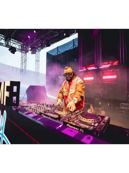 A wide shot of me commanding the stage at the Artist Connect Dance Music Festival. The lights, the sound, the crowd, it was all epic.