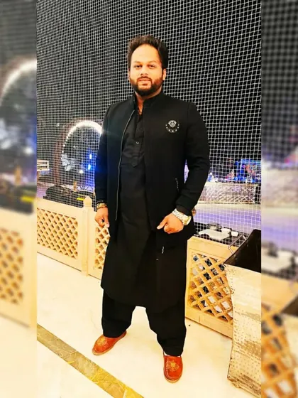 A solo picture from a show in Jaipur. The all-black traditional outfit is a classic choice for Sufi nights.