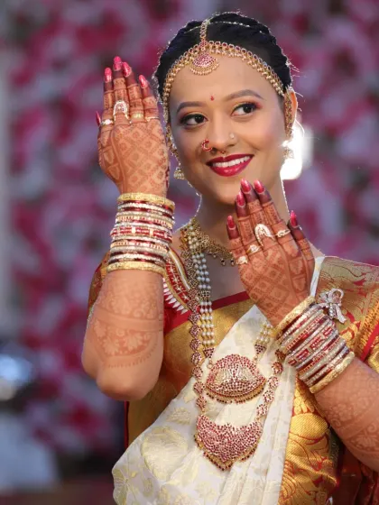 Another lovely shot of the bride, her smile as bright as her henna. The full arm design is visible, adding to the festive and celebratory feel of the moment.