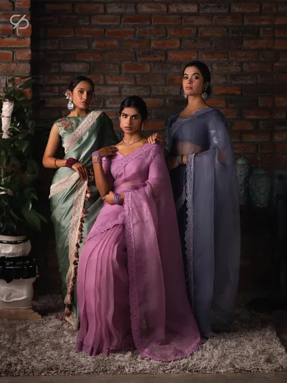 Simplicity and sophistication intertwined. My collection of organza sarees in pastel shades of lavender, sage green, and dusty rose offers a world of timeless, modern allure.