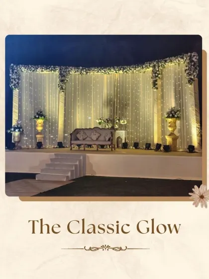 "The Classic Glow" stage design offers timeless elegance. I created this look with a full curtain of warm fairy lights, accented with classic white floral arrangements, providing a simple yet stunning backdrop for the happy couple.