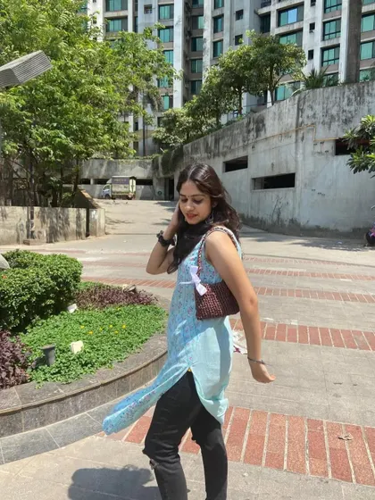 A customer looking amazing with her custom brown ribbon bag. It's a great everyday shoulder bag that's simple yet so pretty.