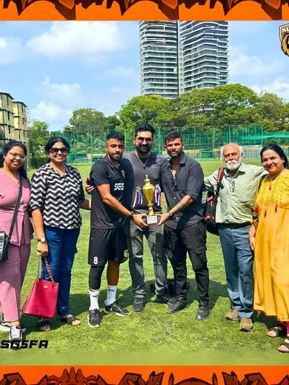 The entire support system. Players, coaches, and family members celebrating together after the MFA 3rd Division finals.