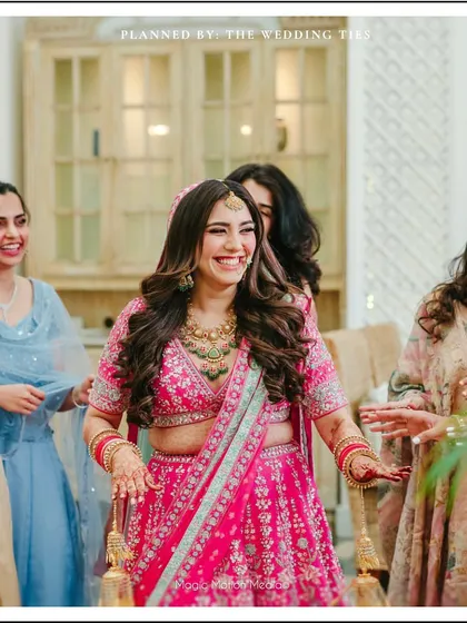 The bride's infectious laughter as she dances with her friends, a moment of pure, uninhibited joy.