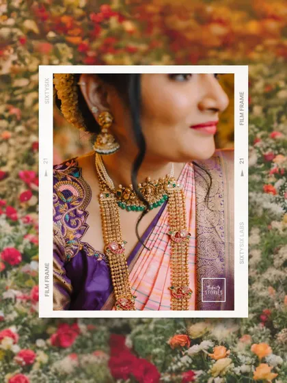 A creative, film-style edit of a close-up bridal portrait, set against a floral background. This artistic shot highlights the intricate details of her jewelry.