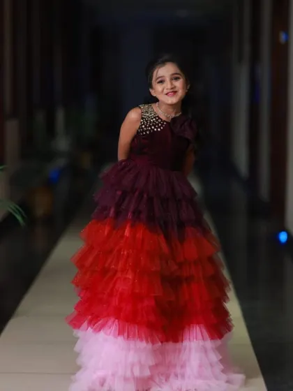 A happy pose from the birthday girl in her unique multi-colored gown.
