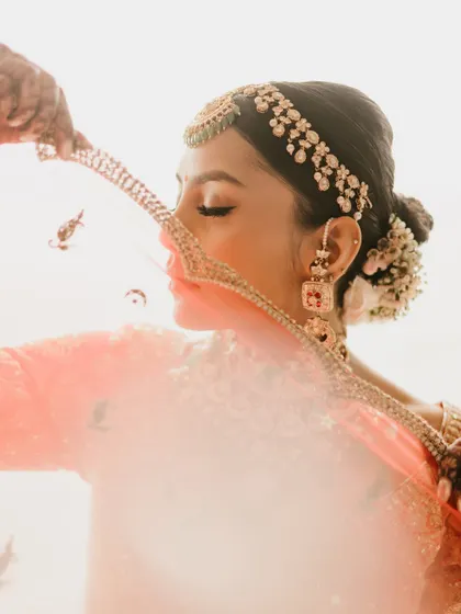 A delicate and artistic shot of the bride, with her veil creating a soft, ethereal filter. It's these creative portraits that become timeless art.