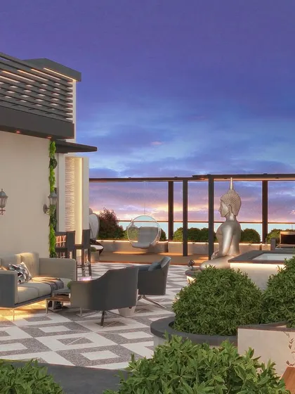 Another angle of the Kirti Nagar terrace, showing the lounge seating, jacuzzi, and stunning sunset view.