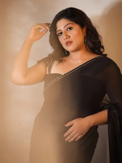 A confident and direct pose, showcasing the simple yet stunning look.