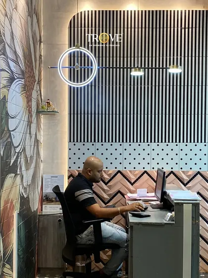 My team is always ready to listen to your ideas and help you find the perfect tile. Here, one of my design consultants is working at a desk surrounded by a variety of our unique and stylish tiles.