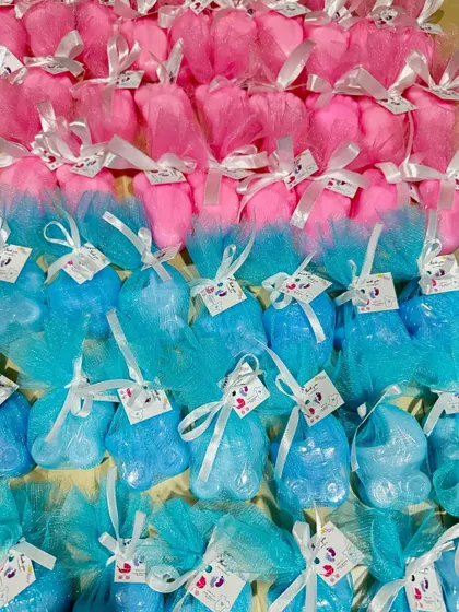 A large batch of our pink and blue baby shower return favors, all packed and ready to go. These are a wonderful way to share the joy of a new arrival.