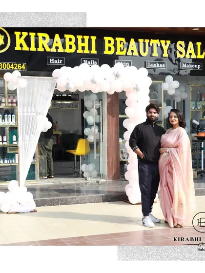 With my partner outside our new salon. We are so grateful for the support and excited for this new chapter.