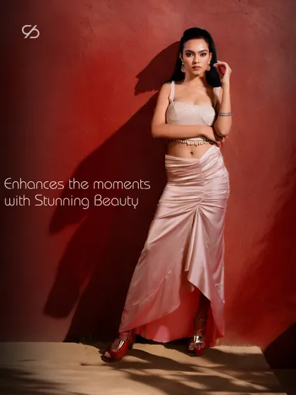 Enhancing the moments with stunning beauty. Miss Earth 2023 wears my design, a two-piece ensemble with a draped satin skirt and a textured crop top, epitomizing elegance.