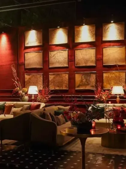 We created multiple lounge areas with plush, comfortable seating to encourage conversation. The wall features custom-made art panels, lit individually to add depth and texture to the space.