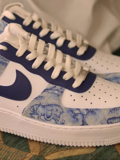 Another look at the custom Dior print AF1s. The intricate, hand-painted animal and jungle scene gives the sneakers a touch of elegance and sophistication.