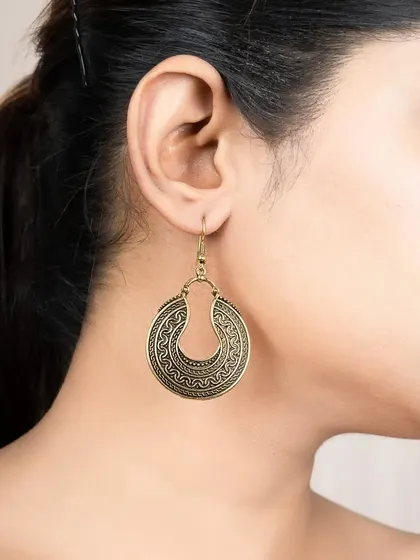 A clean product-on-model shot for a pair of hoop earrings. This style is ideal for catalogues and online stores.