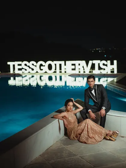 A dramatic, editorial-style shot by the pool. Tessa's reception look was designed to be memorable and photogenic from every angle.