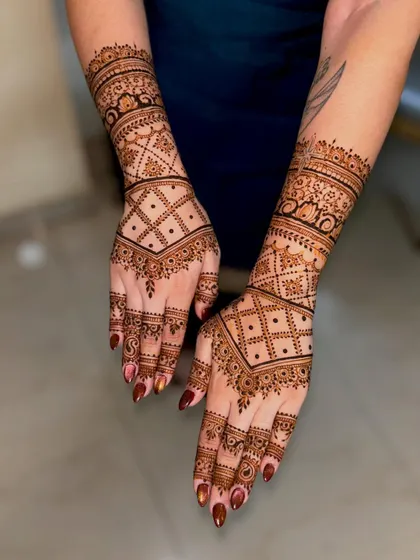 A top-down view of Jyotika's wedding mehendi, showcasing the symmetry and precision of the geometric design.