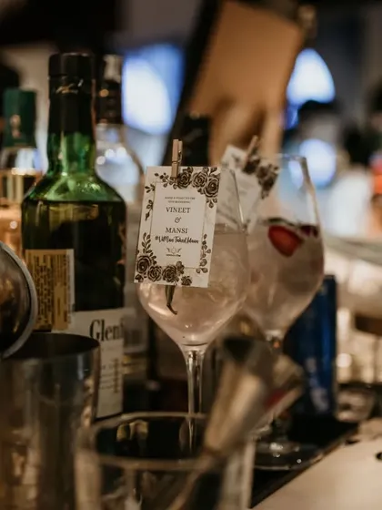 Personalization can be subtle and elegant. This cocktail was served with a custom tag attached to the glass, featuring the couple's names and wedding details.