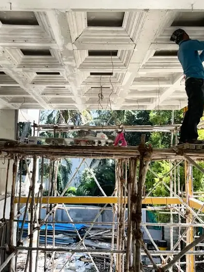 This photo from a site captures our craftsmen working on an intricate coffered ceiling. It highlights the skill and fearlessness required to execute complex designs, turning what was once a drawing into a stunning architectural feature.