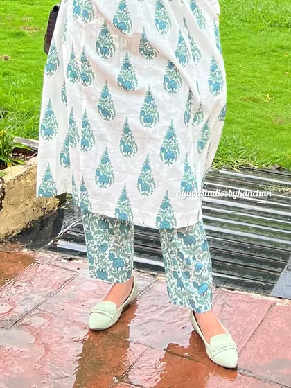 A close up on the details of our white and green printed kurta pant set. This shows the beautiful print and the comfortable fit of the pure cotton fabric.