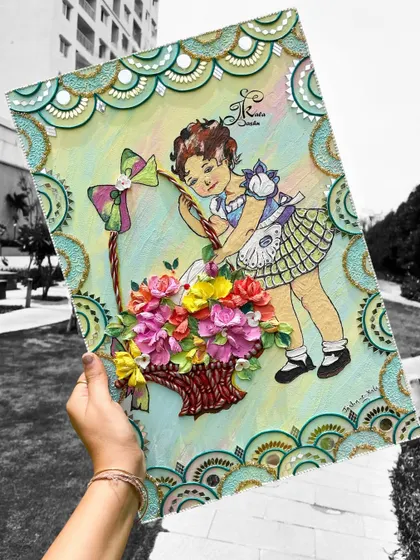 Holding the large rectangular wall art to show its scale and intricate details.