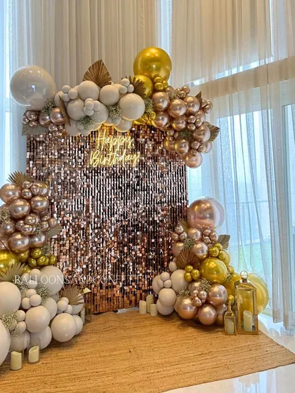 Bringing the glam with this rose gold and white birthday setup. The shimmer wall catches the light beautifully, while the mix of metallic and matte balloons adds texture and luxury. It’s the perfect spot for photos.