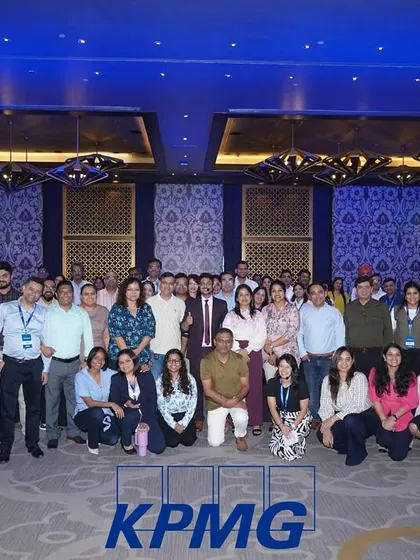 A group photo with the amazing team at KPMG after my performance. Connecting with the audience is the best part of any show.