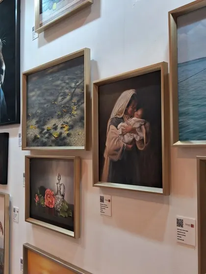 A side view of Zeinab Sarkhosh's gallery wall, showing the depth and realism in her work.