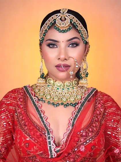 The complete look, showcasing the balance between the heavy traditional jewelry and the expertly applied makeup.
