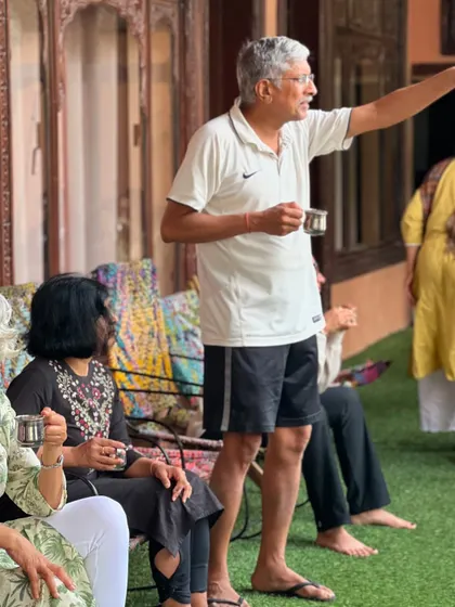 During a break at a retreat, participants relax and chat over a cup of tea. These informal moments of connection are where the bonds of our sangha, or community, are truly strengthened.