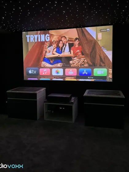 A view of the same four-seater theater, demonstrating the clarity and color accuracy of the projection system across different types of content.
