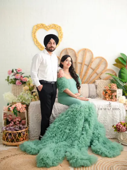 A formal portrait of the couple in our enchanting garden-themed set. This shot captures their loving bond in a beautifully styled, artistic environment.
