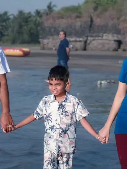 Another angle from the family beach walk, focusing on the connection as they all hold hands. These are the relaxed, happy memories I aim to preserve.