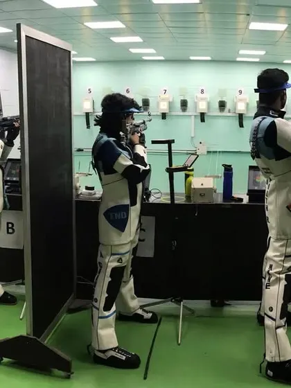 Our shooters practicing behind screens, simulating competition conditions to build mental toughness and reduce distractions.