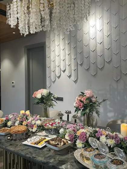 We decorated this dining table with a long floral runner and candles for a post satsang meal. It shows how we carry the festive theme throughout the house to create a cohesive experience for your guests.