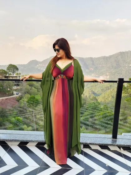 The same maxi dress, layered with a mossy olive green kimono for an effortless, flowy flair against a beautiful mountain backdrop.