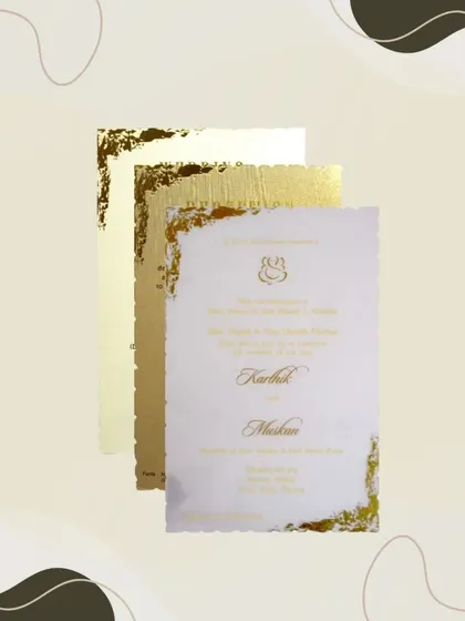 A closer look at the acrylic fiber sheet insert from our metallic light brown invitation, showcasing its unique texture and gold foil details.