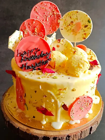 My signature Rasmalai cake, overloaded with homemade rasmalai and decorated with edible chocolate lollipops.