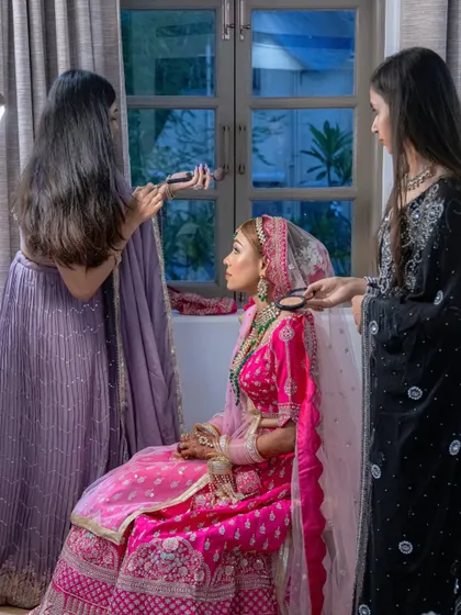 A behind-the-scenes shot of me and my team giving Priyanka her final touch-ups. It takes a village, and I have the best one.