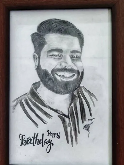 A hand-drawn portrait is one of the most personal gifts you can give. I added a custom "Happy Birthday" message to this framed charcoal sketch to make the occasion even more special.