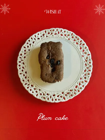 A delicious slice of plum cake on an ornate plate, another essential treat from our Holiday Crate.