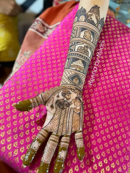 This bridal mehendi captures a beautiful moment of the wedding ceremony. The design shows the varmala (garland exchange) ceremony, a truly personal and memorable touch.