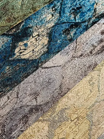 This image displays a range of textured wallpapers in various colors, from deep blue to earthy tones. Each one is designed to add personality and a unique look to your walls.