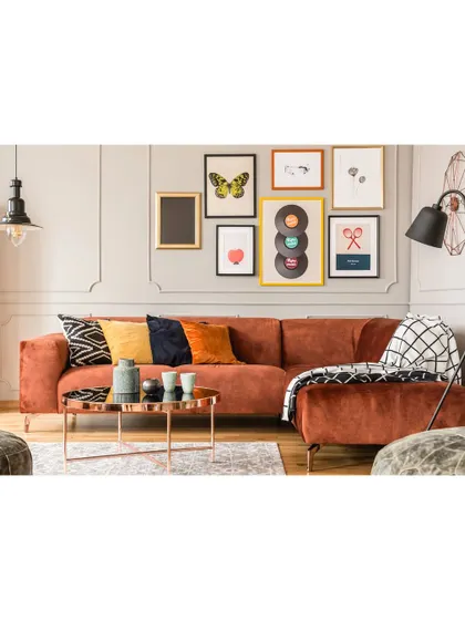 We love creating personalized spaces like this gallery wall. It's a great way to showcase art and memories, adding a unique and colorful touch to any room.