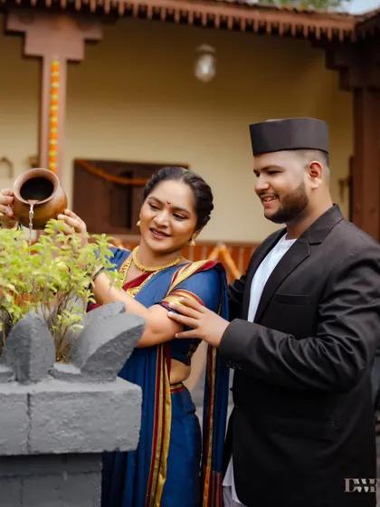 A sacred moment of watering the Tulsi plant together. It's these small, symbolic acts that add depth and meaning to a cultural pre-wedding shoot.
