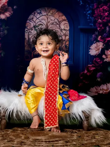 Cuteness overload with our little Krishna. The joy in his smile is absolutely infectious.