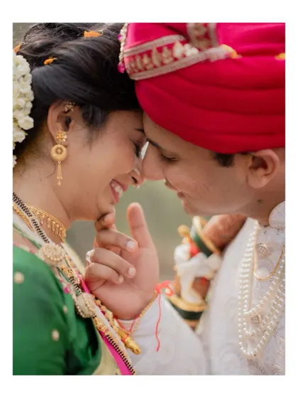An extreme close-up capturing the intimate and happy expression of a Maharashtrian couple on their wedding day.